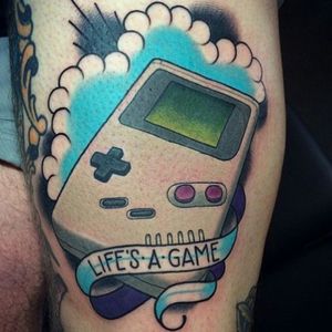 Life's a Game by Jack Goks. Via Instagram @goksisdead #gameboytattoo #gameboy #gameboycolour #colourtattoo #lifeisagame #90stattoo #JackGoks