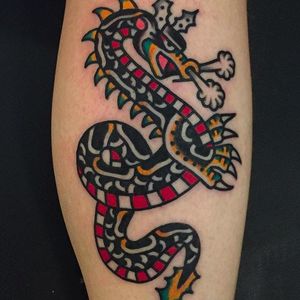 Rad traditional dragon tattoo done by Mark Cross. #MarkCross #rosetattooNYC #TraditionalTattoo #BoldTattoos #dragon