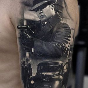 Amazingly realistic cover up via instagram secretflesh_tattoo #gang #mobster #machinegun #blackandgrey #realism #andreystepanov