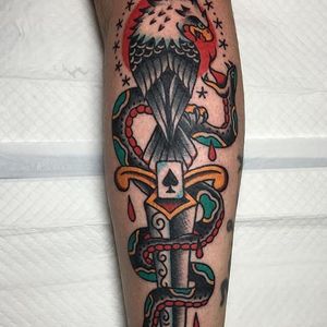 A heavily embellished dagger tattoo with an eagle and snake by Andrew Mcleod (IG—peppermintjones). #AndrewMcleod #dagger #eagle #snake #traditional