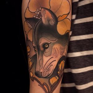 Lovely little wolf tattoo by Chris Green #ChrisGreen #color #neotraditional #wolf #dog #coyote #animal #wildlife #flowers #magnolia #leaves #nature #tattoooftheday