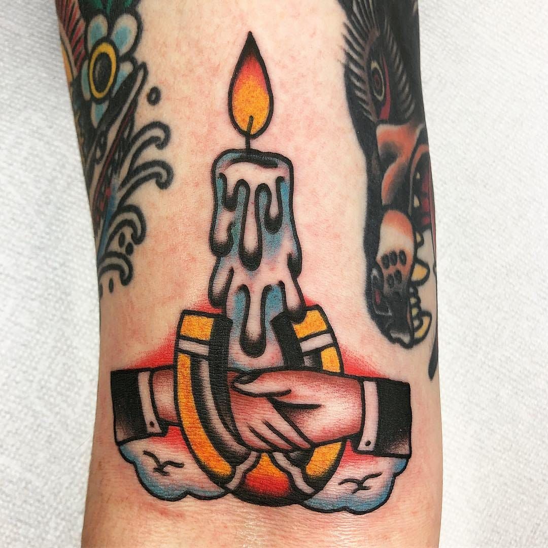 Small candle tattoos are popular these days