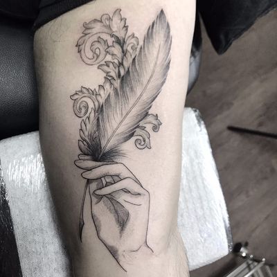 feather tattoo hand