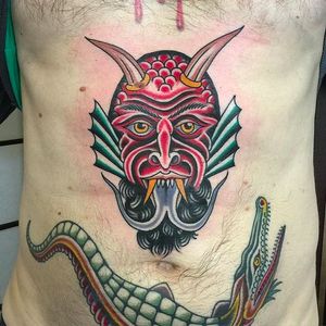Gruesome looking demon head tattoo on the stomach. Tattoo by Nick Mayes. #NickMayes #NorthSeaTattoo #traditionaltattoo #classictattoos #demon #croc