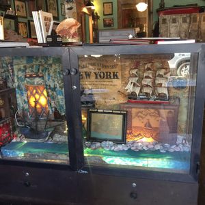 An incredibly fun display case in East River Tattoo, where you make your appointments and chat with the shop managers. Photo by kd diamond. #EastRiverTattoo #NYC #TattooPalor #Shop