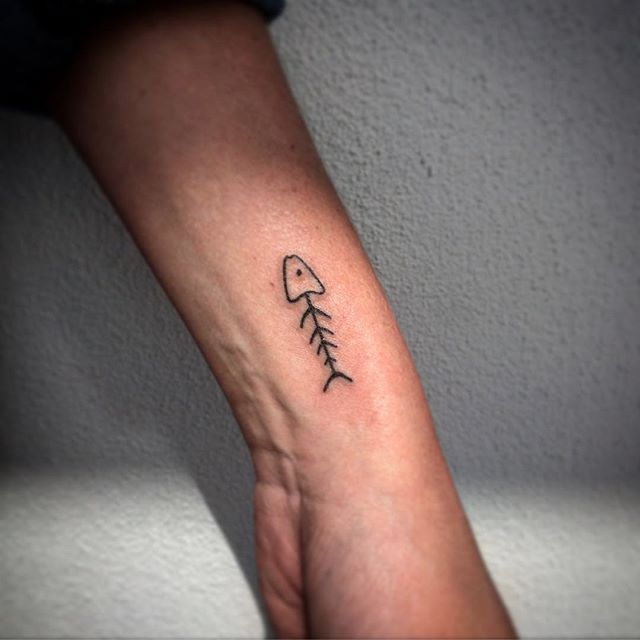 Tattoo uploaded by PK • Fish and bones, by @tattoosbyharry #fishtattoo #fish #fishbone #linework #simple #fineline • Tattoodo