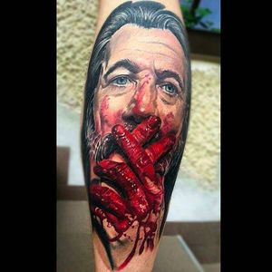 Intense looking bloody color portrait tattoo done by Peter Tattooer. #PeterTattooer #portraittattoo #realistic #bloody #colorportrait #realism #portrait