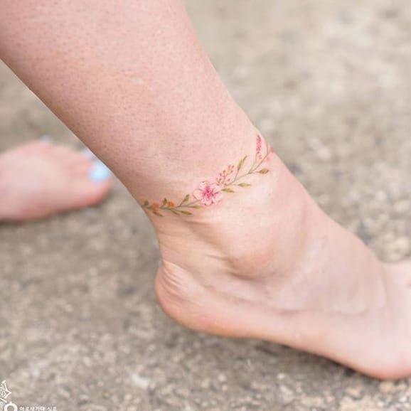 Flower anklet tattoo