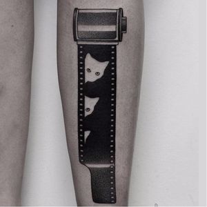 Creative film roll tattoo by Ilya Brezinski #IlyaBrezinski #filmroll #cat #blackwork