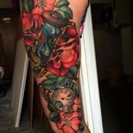 Gorgeous, colorful sleeve of time pieces and flowers, by Joe Frost. (via IG—hellomynamesjoe) #neotraditional #sleeve #joefrost #colorbomb