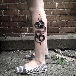 Snake winding up someone's leg, by Sylvie le Sylvie. (via IG—sylvielesylvie) #linework #blacktattoo #simple #SylvieleSylvie