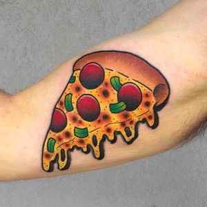 Insane looking pizza tattoo, who doesn't love pizza? Tattoo by Katie McGowan. #katiemcgowan #blackcobratattoo #coloredtattoo #pizza