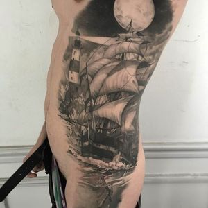 Huge and stunning side tattoo done by Ruben. #Ruben #mikstattoo #blackandgrey #ship #lighthouse #anchor #ribcage