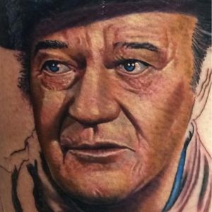 A portrait of John Wayne in progress by Roman Abrego (IG—romantattoos). #color #JohnWayne #portraiture #realism #RomanAbrego #theDuke