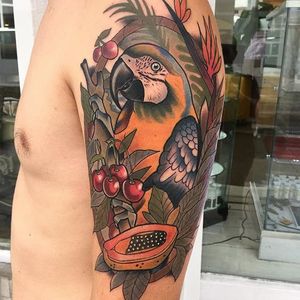 Brightly colored parrot and fruit, by Roger Mares. (via IG—mares_tattooist) #neotraditional #animals #creatures #quirky #rogermares