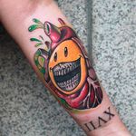 Awesome looking smiley and heart tattoo by Camoz. #camoz #coloredtattoo #smiley