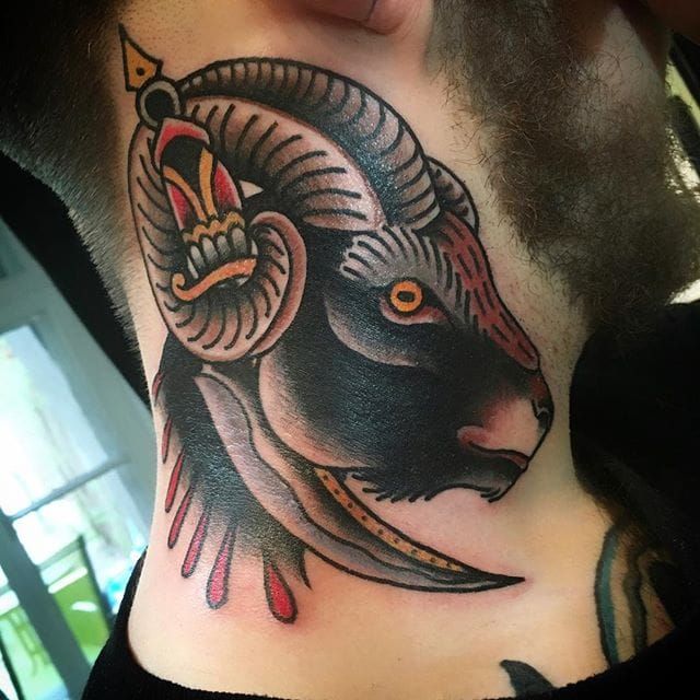 Neotraditional style posh ram tattoo on the right