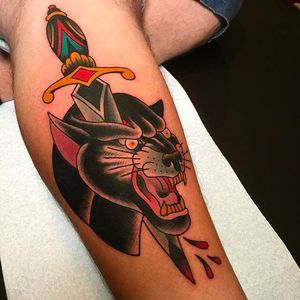 Dagger through a panther head, rad tattoo by Tom Lortie. #TomLortie #traditionaltattoo #coloredtattoo #dagger #panther #blackpanther
