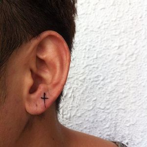 Tattoo by @darrenwentattoo via Instagram #earlobe #earlobetattoo #minimalistic #minimalism #cross