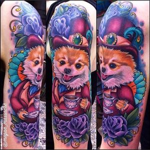 Megan Massacre puts her own mad twist on this pomeranian tattoo. #dog #pomeranian #MeganMassacre #dapper #flower #neotraditional