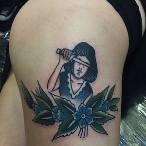 A woman holding a knife to cover the eyes. A very interesting tattoo by Sergey Kartoha. #SergeyKartoha #girltattoo #oldschooltattoo #traditionaltattoo #knife #blossoms