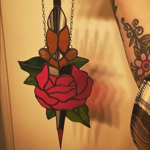 A rose and dagger piece of stained glass art by Gina Ferrara (IG—oxbowglass). #dagger #fineart #GinaFerrara #oxbowglass #rose #stainedglass