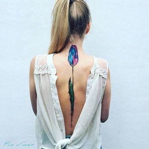 Spine tattoo by Pis Saro. #PisSaro #spine #spineline #back #backbone #line #tulip #flower