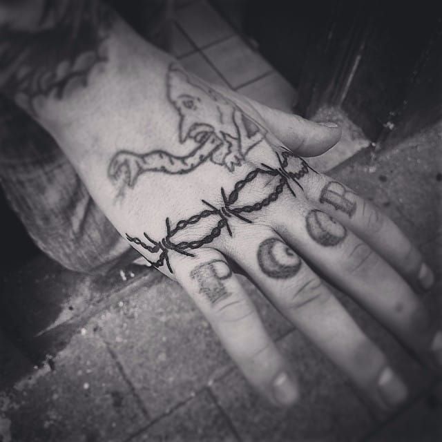 Barbed wire tattoo on the right hand  Hand tattoos for guys Barbed wire  tattoos Knuckle tattoos