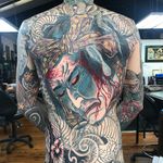Namakubi back piece tattoo by Ryan Ussher #RyanUssher #namakubitattoo #color #Japanese #backpiece #bodysuit #severedhead #clouds #portrait #snake #samurai #blood #bloodsplatter #warrior #death #tattoooftheday