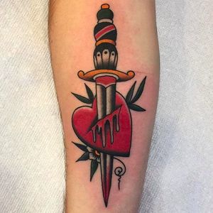 Classic dagger through the heart tattoo. Clean work by Zach Nelligan. #ZachNelligan #MainStayTattoo #traditionaltattoo #classic #dagger #heart