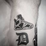Sneaker tattoo by Ulrich aka Buro125 #Ulrich #Buro125 #fashiontattoos #blackandgrey #linework #dotwork #newtraditional #sneakers #AirJordan #shoes #basketball #illustrative #tattoooftheday