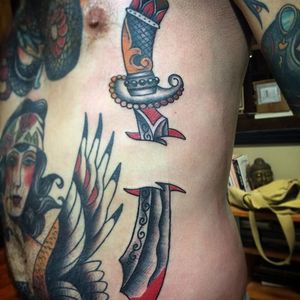 Sword and skin rip by Nick Rutherford. #traditional #NickRutherford #tattooflash #skinrip #sword #dagger