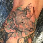 Neo traditional watercolor rhinoceros tattoo by Clare Lambert. #watercolor #ClareLambert #neotraditional #rhinoceros