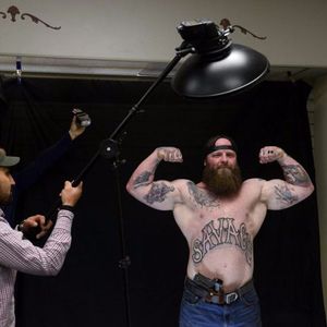 Kyle McCamless getting photographed at the tattoo party Photography courtesy of Bob Hallinen at the Alaska Dispatch News #BobHallinen #ADN