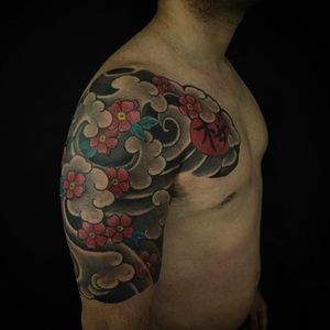 Chest to half sleeve wind and sakura tattoos by Luciano Vazquez. #LucianoVazquez #JapaneseStyle #irezumi #japanesetattoo #blossoms #sakura.
