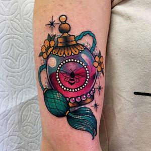 Tattoo by Roberto Euan #RobertoEuan #newtraditional #color #perfume #bottle #glass #flowers #bee #pearls #sparkle #glitter