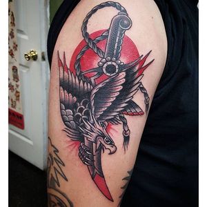 Stabbing dagger tattoo by Steven Madrid #StevenMadrid #daggerthroughtattoo #stabbingdagger #dagger #bird #eagle #