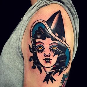 Solid and clean witch head tattoo done by Mark Cross. #MarkCross #rosetattooNYC #TraditionalTattoo #BoldTattoos #witch #girlhead