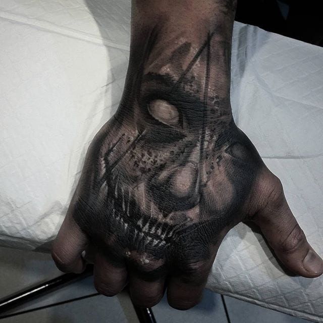 Black and grey realism custom rose hand tattoo by Aaron Carey  Rose hand  tattoo Hand tattoos Rose tattoos for men