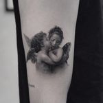 Cherub tattoo by Cold Gray #ColdGray #blackandgrey #realism #realistic #hyperrealism #cherub #angel #wings #feather #baby #child #portrait #love #religious