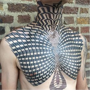 Geometric chest tattoo by Kenji Alucky, photo from Kenji's Instagram @black_ink_power #geometric #blackwork #tribal #patternwork #dotwork