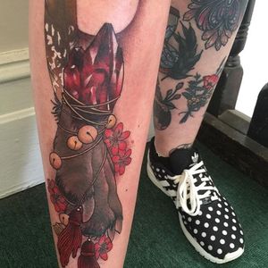 Bound gem and wolf foot tattoo by Kaitlin Greenwood. #neotraditional #KaitlinGreenwood #wolf #foot #wolffoot #flowers #gem