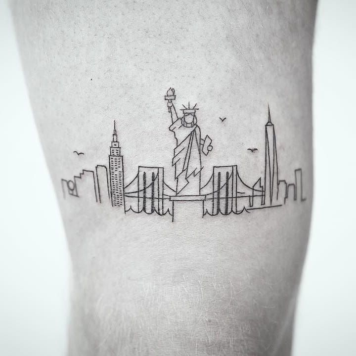Single needle Empire State Building tattoo