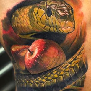 Snake and apple tattoo by Dongkyu Lee @q_tattoos #dongkyu #dongkyulee #realism #realistic #portrait #korea #snake #apple #GardenofEden #serpent