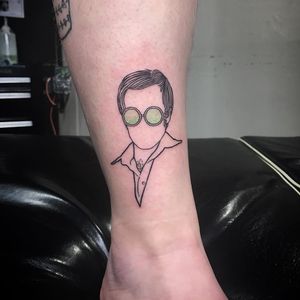 Elton John tattoo by Randi Fitzpatrick #RandiFitzpatrick #musictattoos #linework #minimal #color #sunglasses #EltonJohn #portrait #bust #glam #music #singer #simple #small #tattoooftheday