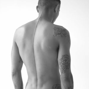 Man with a spine line tattoo, photo by Ivania Carpio. #spineline #line #seamline #spine #minimalist