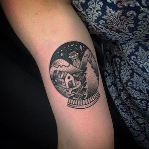 UFO in the woods in a snow globe tattoo by Stacey Green. #snowglobe #glass #dotwork
