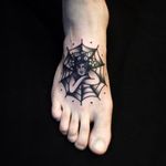 Cool foot tattoo of a girl on a spider web. Tattoo by Andre Albuquerque. Photo: @albvquerque #andrealbuquerque #black #traditional #foottattoo