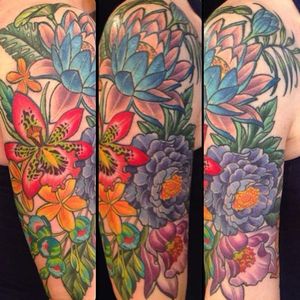 Tropical flower half sleeve by Kim Saigh. #halfsleeve #flowers #tropical #colorful #neotraditional #KimSaigh
