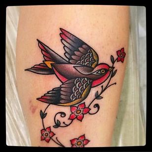 Swallow bird and blossoms Tattoo por @Capratattoo #Capratattoo #traditional #black #red #SkullfieldTattoo #swallow #bird #blossoms